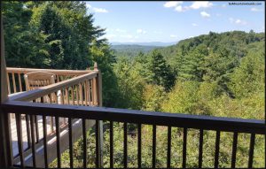 Above the Rest Cabin Deck w/ Rocking Chairs & Mountain Views - GaMountainsGuide.com