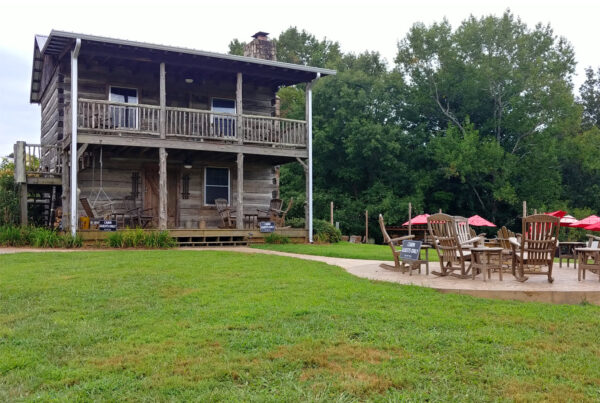 Restored log cabin rental at Cavender Creek Vineyards and Winery