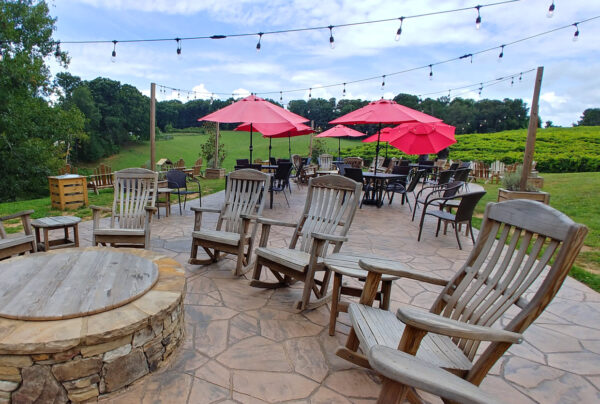 Patio seating by the vines at Cavender Creek Vineyards and Winery