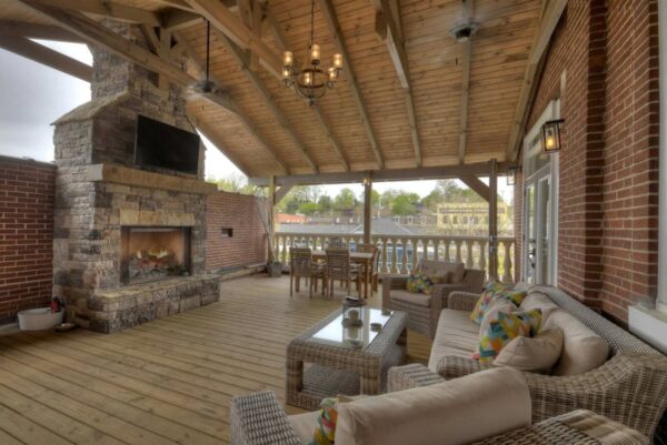 Covered deck with fireplace and views of Blue Ridge Scenic Railway