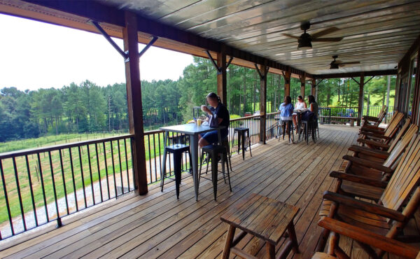 Rocking chair porch with farm views at Sweet Acre Farm Ga