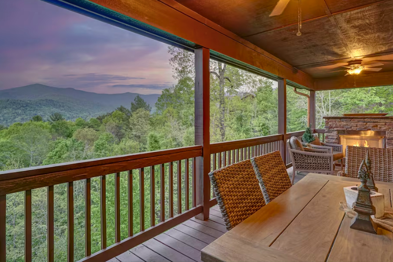Covered deck and mountain view at a Blairsville cabin near two scenic routes