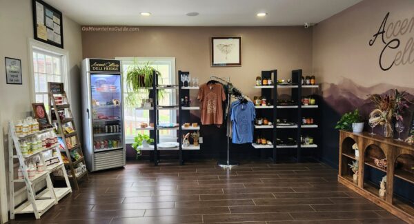 Gift displays, clothing, and refrigerated snacks inside Accent Cellars
