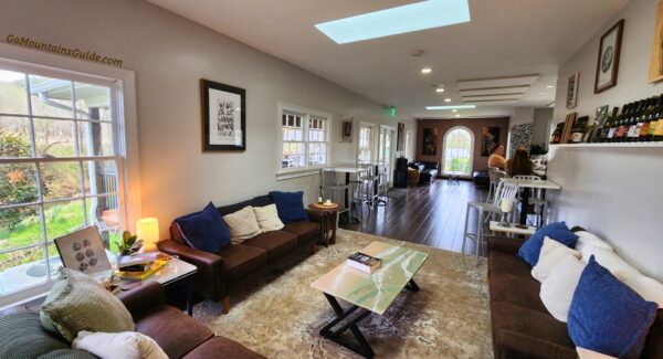 Sofas, coffee table, and indoor tables at Accent Cellars in Dahlonega